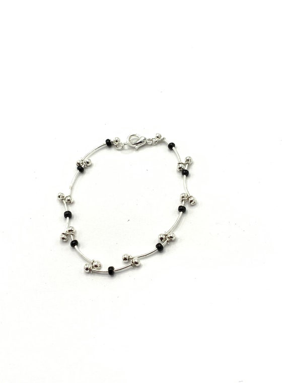 Gorgeous collectible silver and black bracelet.