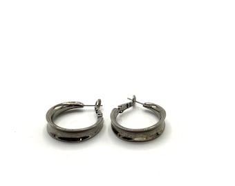 Gorgeous collectible dark tone round earring by Lia Sophia.