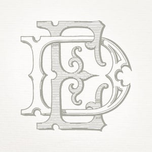 May include: A vintage-style monogram design featuring the letters "E" and "D" intertwined. The letters are in a decorative, ornate font with intricate details.