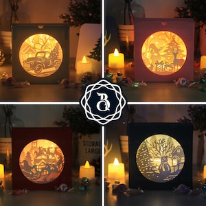 May include: Four different Christmas light-up papercraft scenes. Each scene is in a square box with a light-up circle in the centre. The scenes include a truck with a Christmas tree, a family with a Christmas tree, a Santa Claus with a sleigh, and a snowman with a Christmas tree.