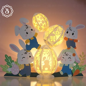 Cute Bunnies Holding Easter Eggs Paper Cut Template, Happy Easter Paper Lanterns SVG files