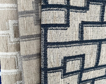 May include: Three fabric swatches with geometric patterns. The swatches are beige with black, gray, and white geometric designs.