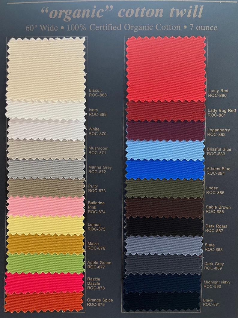 May include: Swatch card of 15 different colors of organic cotton twill fabric. Each color swatch is labeled with a color name and a code, such as "Biscuit ROC-868" and "Lusty Red ROC-880".
