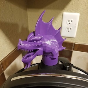 May include: Purple 3D printed dragon head pressure cooker lid handle replacement.