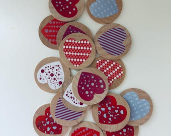 May include: A set of 13 wooden heart-shaped tiles with various red, white, and gray patterned designs. The tiles are perfect for crafts, games, or decorations.