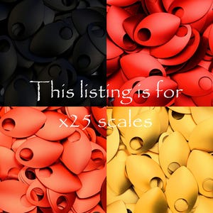 May include: A close-up image of 25 scales for crafting. The scales are in three colors: black, red, and gold. This listing is for x25 scales.