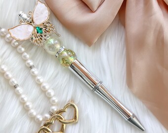Bolígrafo de cristal de mariposa: alas perladas, diamantes de imitación y cuentas de gemas
