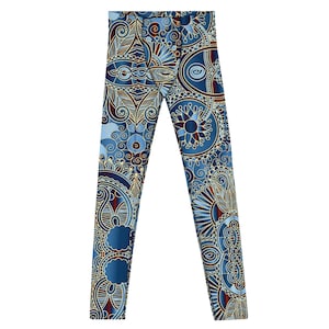 May include: Blue leggings with a detailed floral pattern in shades of blue, cream, and burgundy. The leggings feature an all-over design with intricate swirls, leaves, and circular motifs. The leggings are made of a soft, stretchy material.