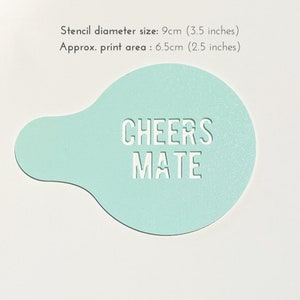 May include: A light blue plastic stencil with the text "CHEERS MATE" cut out. The stencil is 9 inches in diameter and has a print area of 6.5 inches.
