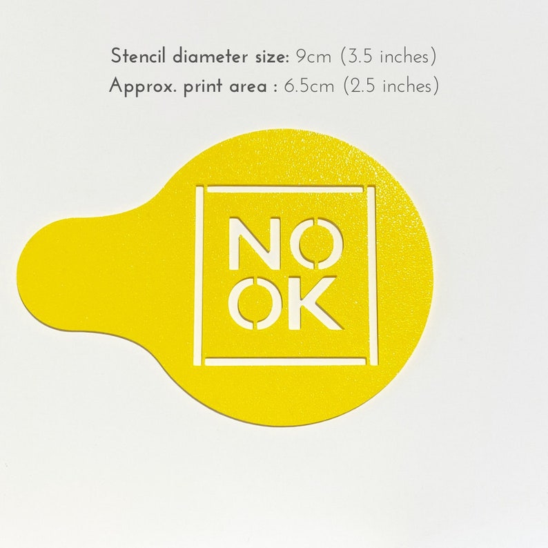 May include: Yellow plastic stencil with a 3.5 inch diameter. The stencil is shaped like a circle with a small handle on the side. The stencil has the words "NO OK" cut out in a white square.