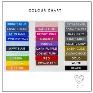 May include: Color chart showing 18 different colors of acrylic plastic. The colors are arranged in three columns: blue, pink, and silver. The colors include bright blue, cosmic blue, satin blue, translucent blue, light blue, navy blue, pastel green, green, yellow, orange, light pink, satin pink, bright pink, magenta, purple, dark purple, cosmic plum, red, cosmic red, satin silver, cosmic silver, dark grey, light grey, cosmic grey, satin gold, cosmic gold, gold, white, and black.
