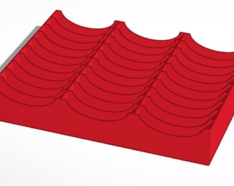 May include: Red plastic storage organizer with multiple curved compartments.