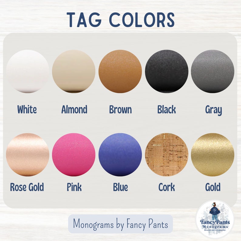 May include: A chart displaying ten different colour options for personalised tags. The colours are white, almond, brown, black, grey, rose gold, pink, blue, cork, and gold.