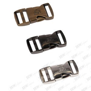 May include: Three metal side release buckles in bronze, black, and silver. Each buckle has a rectangular shape with a central opening and a logo. The buckles are designed for various crafting and sewing projects.