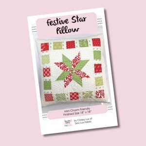 May include: A digital pattern for a festive star pillow, featuring a red and green star design with a white background. The pattern is mini charm friendly and the finished pillow size is 18 inches by 18 inches. The pattern is by Chrissy Lux of Sew Lux Fabric.