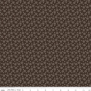 May include: A brown fabric with a repeating pattern of white interlocking circles and small white dots.