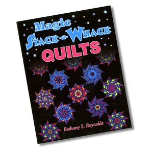 May include: Book cover with the title "Magic Stack-n-Whack Quilts" by Bethany S. Reynolds. The cover features a black background with colorful star-shaped quilt blocks.