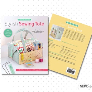 May include: A sewing pattern booklet titled Stylish Sewing Tote by Kristyne Czepuryk. The cover displays a fabric tote bag with floral and strawberry prints, two handles, and sewing notions. Includes wire frames and a hoop pull zipper for assembly.