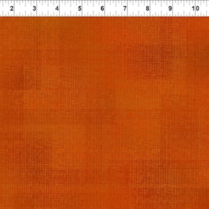 May include: A close-up of a textured orange fabric with a subtle grid pattern. The fabric has a slightly faded look, giving it a vintage feel.