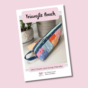 May include: A colorful triangle-shaped pouch with a zipper closure and a strap. The pouch is made from patchwork fabric with a star pattern and is labeled "Triangle Pouch" and "Mini Charm and Scrap Friendly!" by Chrissy Lux of Sew Lux Fabric.
