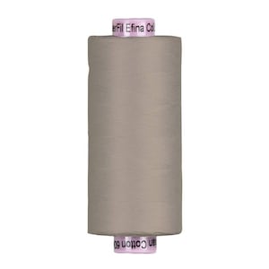 May include: A spool of light taupe thread with the text "erFil Efina Col" and "an Cotton 60" printed on the pink labels. The thread is tightly wound on a cylindrical spool, suitable for sewing and crafting projects.