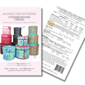 May include: A sewing pattern titled Aunties Two Patterns Covered Round Crates. The front shows three stacks of round fabric crates in floral and solid colors. The back displays a detailed materials list, fabric requirements, and a barcode.