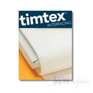 May include: A roll of white Timtex interfacing fabric featuring a dark blue header with the white text timtex INTERFACING. The material is folded over a white cardboard core, with a portion of the orange packaging visible at the bottom left corner.