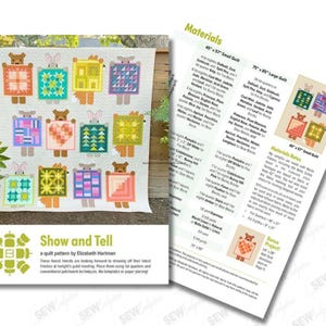 May include: A colorful quilt with bear and bunny figures holding patterned blocks. The quilt is displayed outdoors with a wooden fence background. Accompanying the quilt is a pattern sheet with material details and a bonus project.