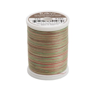 May include: A spool of Sulky 100% cotton-coated mercerized thread in shades of green, red, and brown. The spool is labeled "Sulky" and "733 4107".