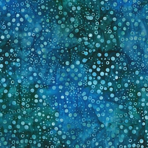 May include: A fabric with a mottled pattern in shades of blue and teal. The design features a scattering of white and light blue circles of varying sizes, creating a textured, aquatic appearance. The fabric has a batik-like quality.