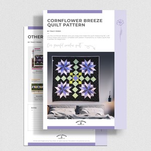 May include: A quilt pattern for a Cornflower Breeze quilt measuring 56 inches by 56 inches. The pattern features a quilt with a black background and a starburst design in shades of blue, green, and white. The text "Our peaceful meadow quilt" is written in cursive above the quilt.