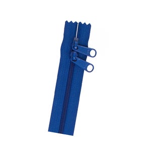 May include: A blue zipper with two metal pull tabs.