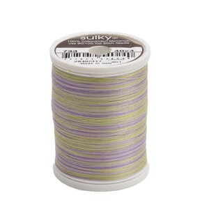 May include: A spool of Sulky 100% Cotton/Cotton Mercerized thread in a green, purple, and yellow color combination. The spool is labeled "Sulky 100% Cotton/Cotton Mercerized Use #80/100 Top Stitch Needles 733 4024".