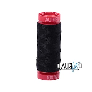 May include: A spool of black thread with a red label that says "Aurifil" and "100% Cotton".
