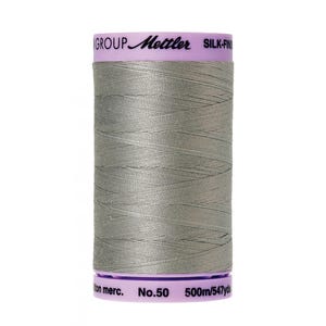 May include: A spool of gray thread with a label that reads "GROUP Mettler SILK-FINISH No.50 500m/547yd cotton merc."