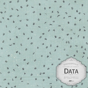May include: A light blue fabric featuring a scattered pattern of small, dark gray numbers. A white, scalloped-edge label is attached to the bottom right corner, displaying the text SEWENDIPITOUS GALLERY OF FABRIC DATA MODA FABRICS BY JANET CLARE.