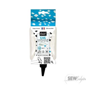 May include: A white tube of Odif 606 permanent adhesive for fabric. The packaging includes the text "Made in France" and "100% recyclable." The net weight is 2.12 oz (60 g). The top of the package is blue with white diamond shapes.