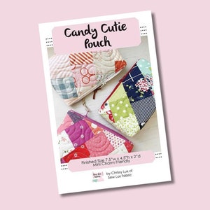 May include: A sewing pattern for a Candy Cutie Pouch, a small quilted bag with a zipper closure. The pattern includes three different pouch designs with colorful patchwork fabric. The finished size of the pouch is 7.5 inches wide by 4.5 inches high by 2 inches deep. The pattern is designed to be mini charm friendly.