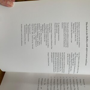 May include: Open book page with text, including "This book is for Shelley, with appreciation and love." The text is in black font on a white background. The book is part of an exhibition at the National Museum of African Art.