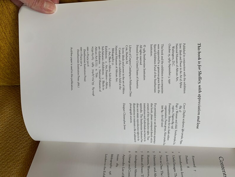 May include: Open book page with text, including "This book is for Shelley, with appreciation and love." The text is in black font on a white background. The book is part of an exhibition at the National Museum of African Art.