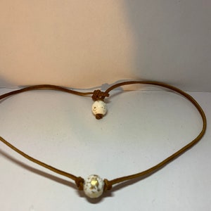 Brown leather sparkly cream beaded necklace. 16 inch.  Slide hook.