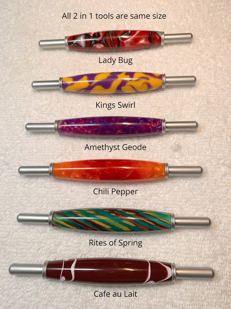 May include: Six 2-in-1 tools with silver metal ends and patterned acrylic barrels. The designs are labeled Lady Bug, Kings Swirl, Amethyst Geode, Chili Pepper, Rites of Spring, and Cafe au Lait. The text states: All 2 in 1 tools are same size.