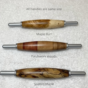 May include: Three wooden handles with silver metal ends, labeled as Maple Burl, Patchwork Woods, and Spalted Maple. The text states all handles are same size. Each handle features a distinct wood grain pattern, ranging from light swirls to dark, contrasting segments and intricate, dark, marbled lines.