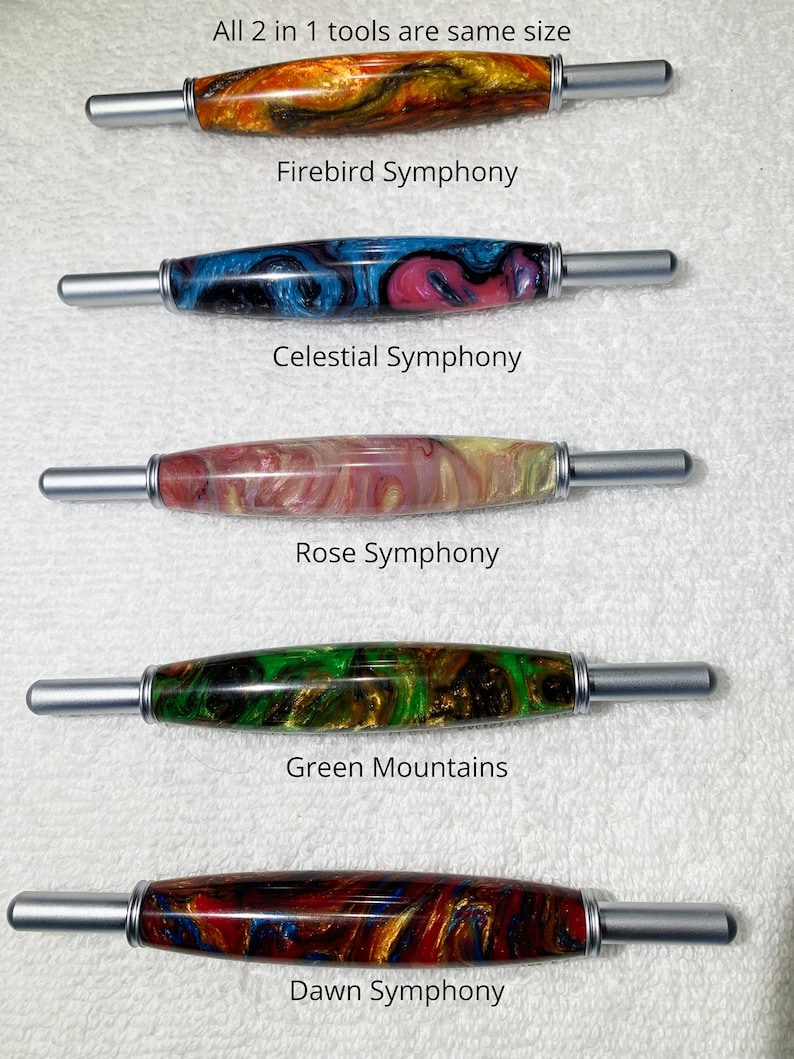 May include: Five different 2-in-1 tools with colorful, marbled wooden handles and silver metal ends. The tools are labeled "Firebird Symphony", "Celestial Symphony", "Rose Symphony", "Green Mountains", and "Dawn Symphony".