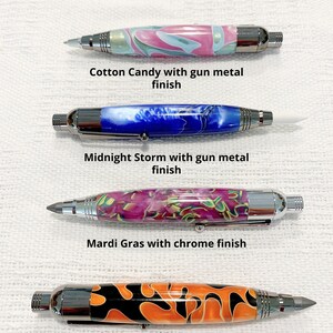 May include: Four 3 in 1 marking tools. The first is Cotton Candy with gun metal finish. The second is Midnight Storm with gun metal finish. The third is Mardi Gras with chrome finish. The fourth is Witches Brew with gun metal finish. Each tool features a patterned barrel and metallic hardware.