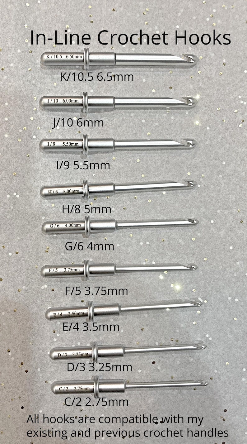 May include: A set of silver crochet hooks with different sizes labeled in millimeters. The hooks are arranged from largest to smallest. The text "In-Line Crochet Hooks" is at the top of the image. The text "All hooks are compatible with my existing and previous crochet handles" is at the bottom of the image.