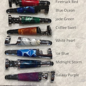 May include: Ten different colored stylus pens with bottle openers. The colors are turquoise swirl, firetruck red, blue ocean, jade green, coffee swirl, white pearl, ice blue, midnight storm, galaxy purple, and purple passion.