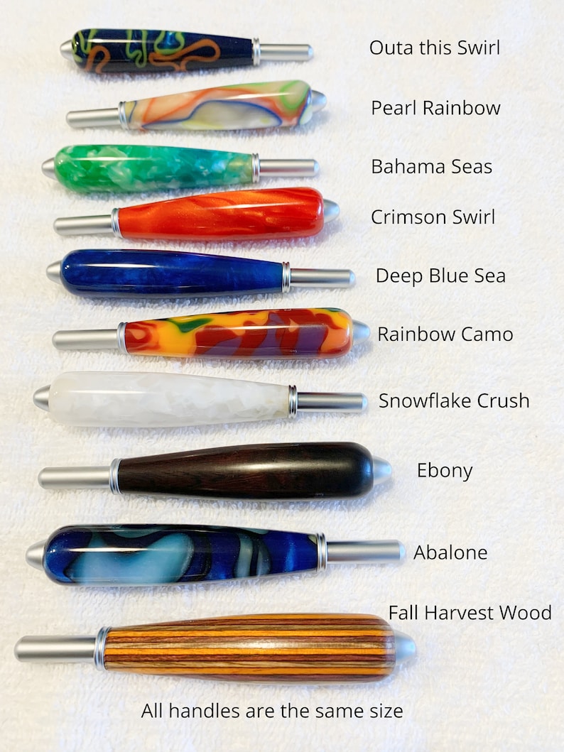 May include: Ten craft tool handles with silver metal tips, arranged vertically. Colors include Outa this Swirl, Pearl Rainbow, Bahama Seas, Crimson Swirl, Deep Blue Sea, Rainbow Camo, Snowflake Crush, Ebony, Abalone, and Fall Harvest Wood.