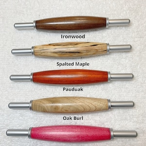 May include: Five wooden handles with silver metal ends. The handles are made of different types of wood: ironwood, spalted maple, pauduak, oak burl, and pink tinted maple. All handles are the same size. "All handles are the same size" is written at the top of the image.