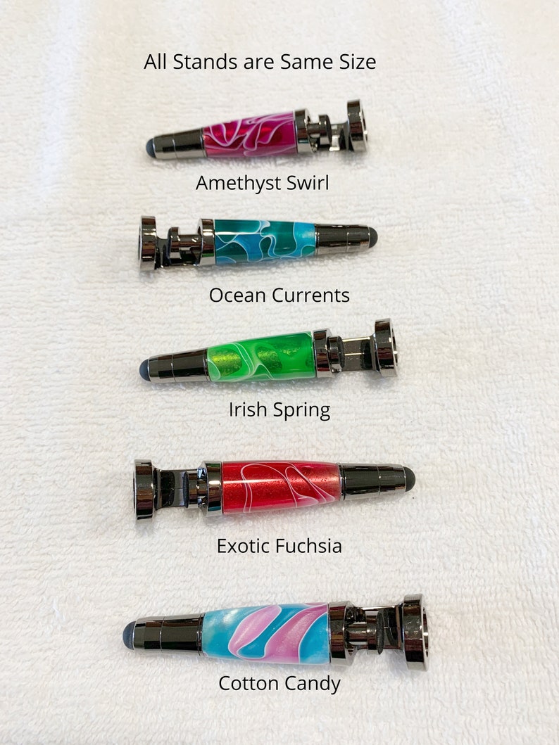 May include: Five different colored stylus pens with metal tops and bottoms. The pens are arranged vertically with the text "All Stands are Same Size" at the top and the names of each pen color below each pen. The names are "Amethyst Swirl", "Ocean Currents", "Irish Spring", "Exotic Fuchsia", and "Cotton Candy".